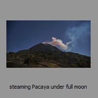 steaming Pacaya under full moon